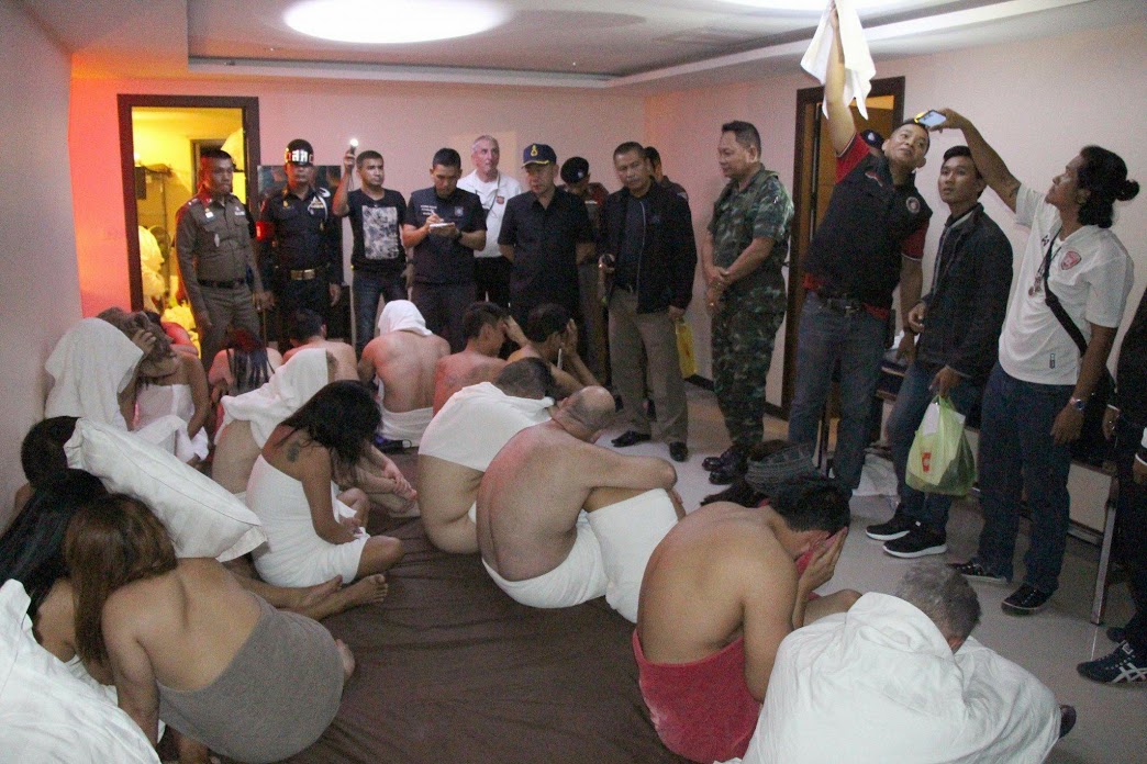 NEWS COPY - WITH VIDEO AND PICTURESDramatic footage shows the moment police raided an illegal hotel ORGY - catching dozens of middled-aged men with young Thai women. Officers were tipped off about the seedy swingers parties in Pattaya, Thailand, where guests would pay 1,500 baht (35GBP) to attend. Cops and army officers stormed in last night (Sat) at 11.30pm sparking chaotic scenes as naked girls scrambled to cover themselves with towels. Video from a news reporter embedded with the police captured the moment 18 men - many sweating heavily - were rounded up with their female ''partners''.The guests - including Brits, Americans, Germans, Canadians, Australians, Russians, Malaysians and Chinese - were questioned and released. While the Chinese hotel owner - seen in an Abercrombie & Fitch top - was arrested.Naris Niwapantawong, District Sheriff in the Banglamung area of Pattaya where the raid happened, said the men ''exchanged partners with each other''.  SEE VIDEO DESK AND WIRE FOR FOOTAGE AND FULL COPY.