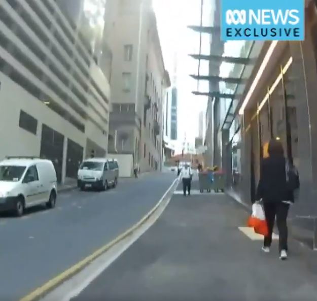 That guy in the distance owns this f**ken footpath. Credit: ABC News