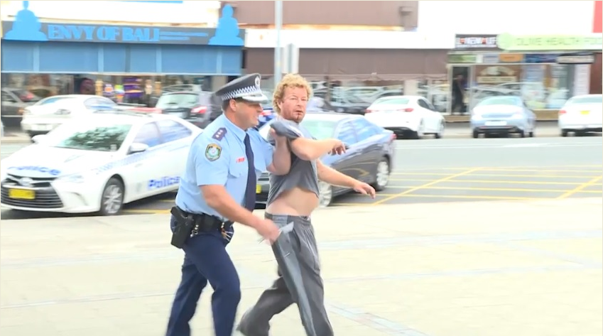 Policeman Stops Press Conference On Live TV To Arrest Beer Drinking Heckler