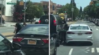 Wild road rage brawl in the middle of the street ends with car-smash finishing move