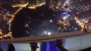 Base jumper makes f*cken epic entrance to rooftop pool party