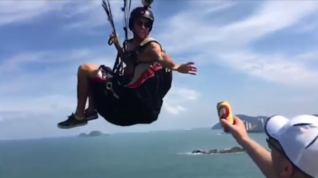F*cken legend catches a beer while hang gliding