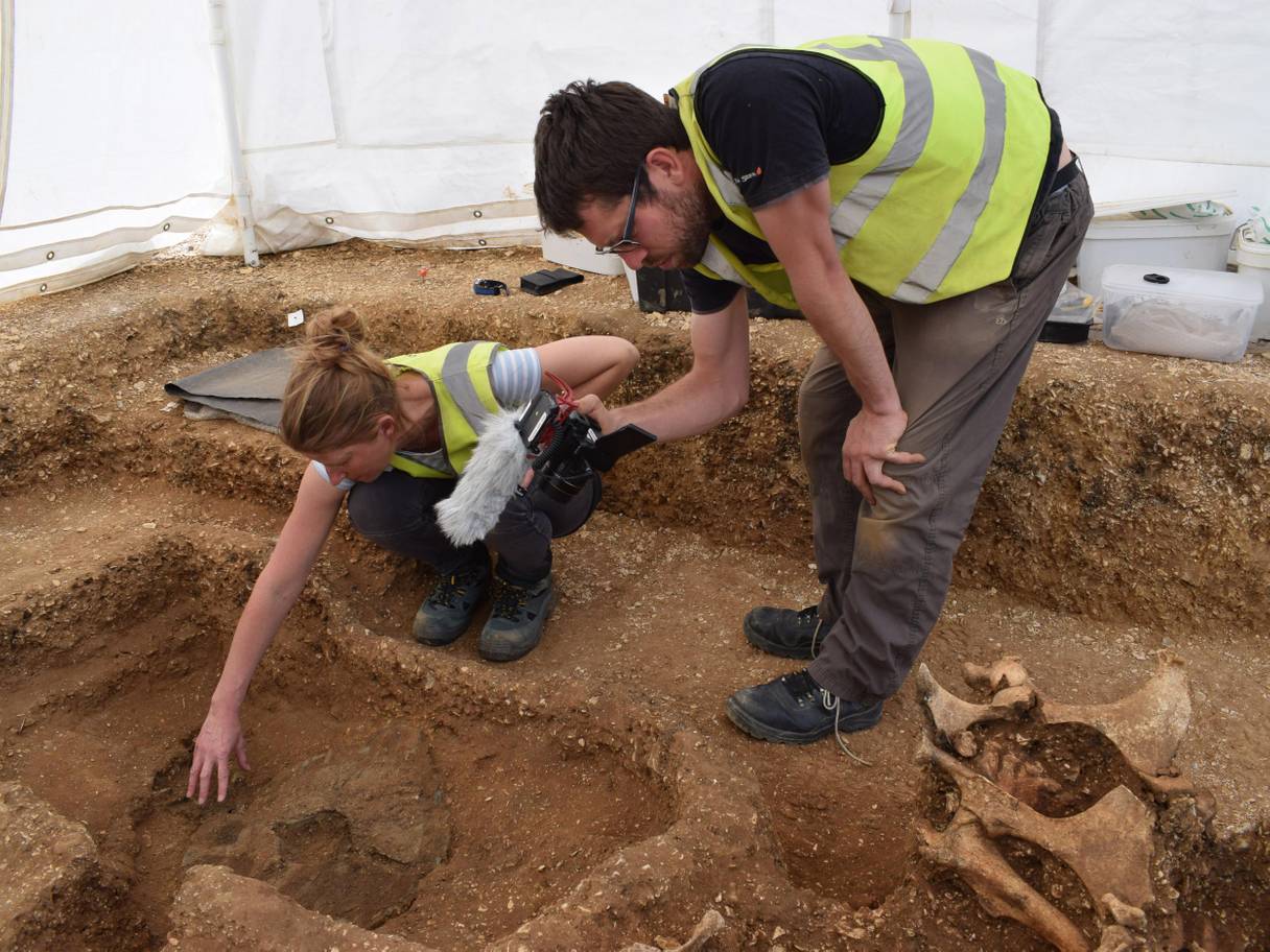 Unearthing the chariot. Credit: David Keys/BBC