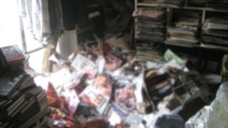 Man dies after massive stack of porn magazines falls on him