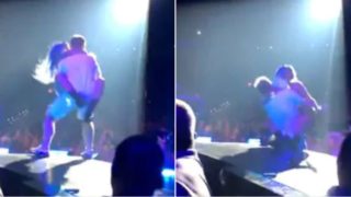 Lady Gaga falls off stage while dancing with fan during live show