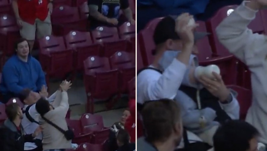 F**ken Super-dad at Reds game takes classic catch while feeding baby